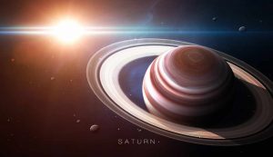 Saturno con i suoi anelli e in lontananza il sole